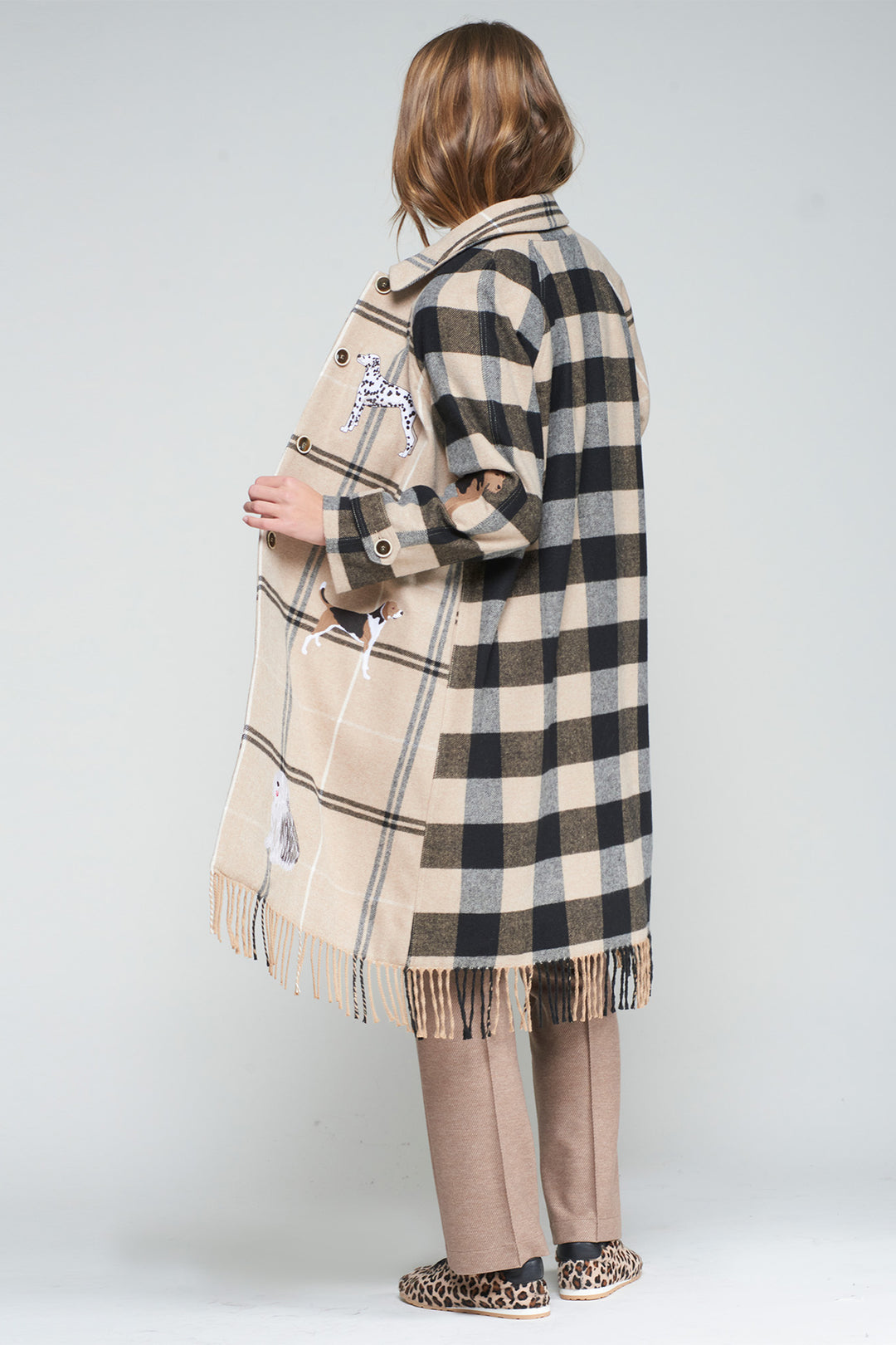 Person wearing a checkered coat with a white background