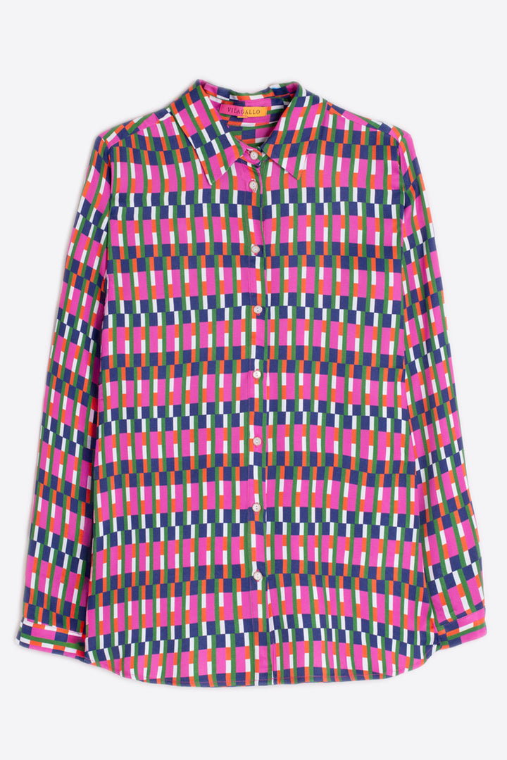 Colorful geometric patterned shirt on a white background