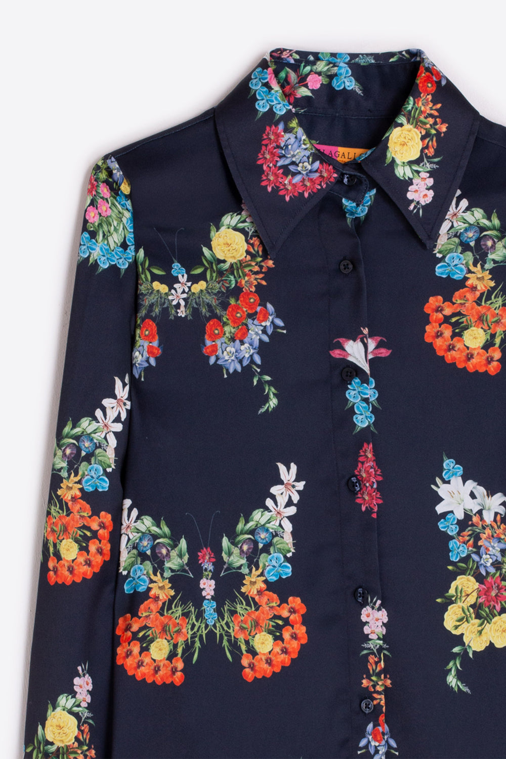 Navy shirt with colorful floral embroidery on a white background