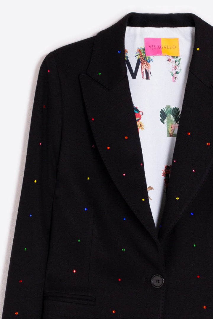 Black blazer with colorful specks on a white background
