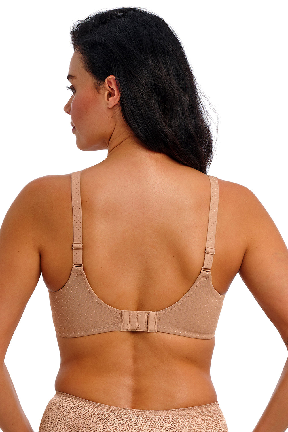 Woman wearing a beige bra on a white background