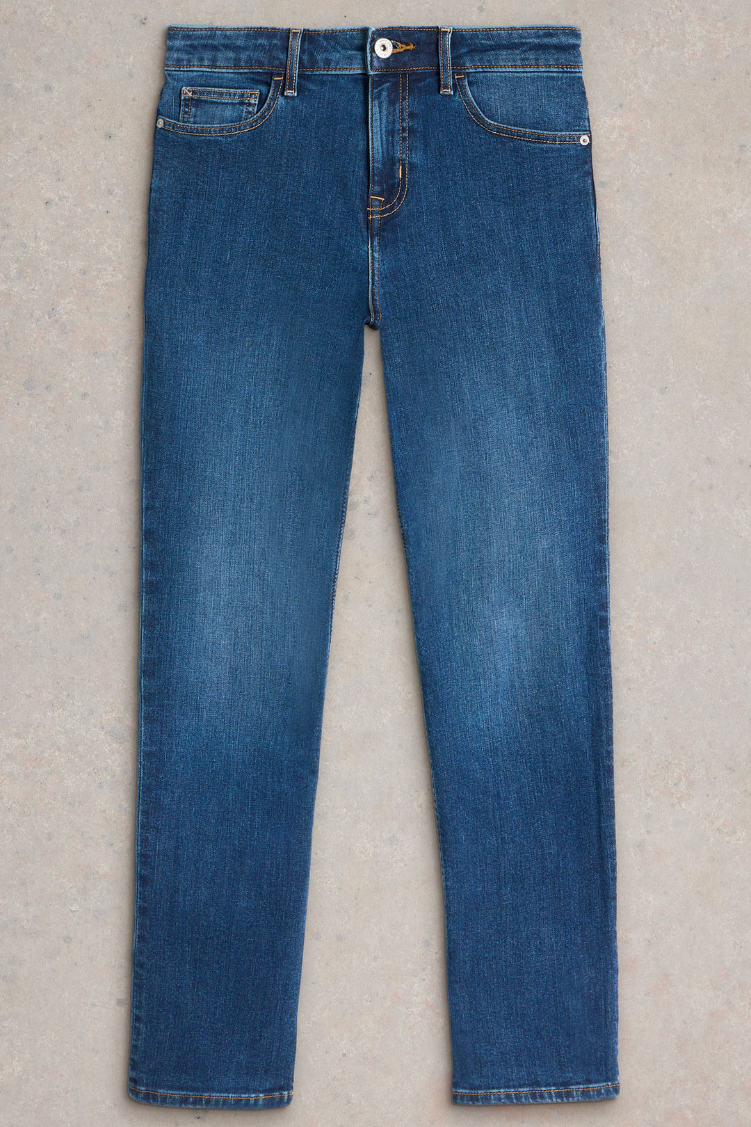 Pair of blue jeans on a light gray background