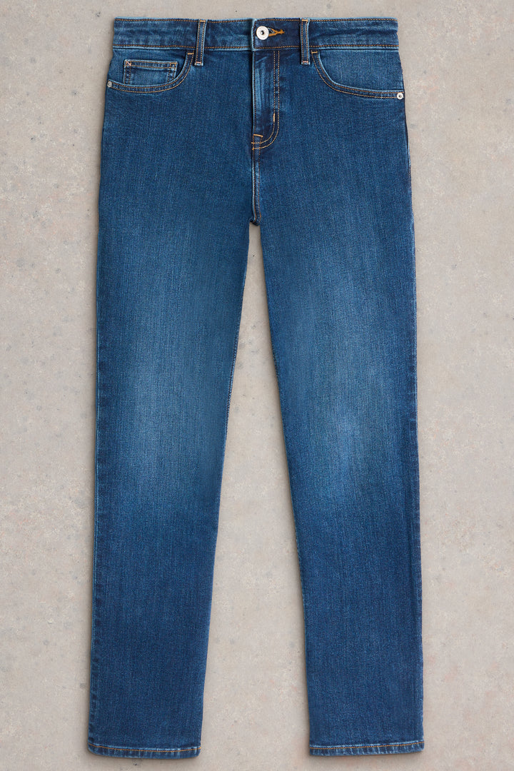 Pair of blue jeans on a light gray background