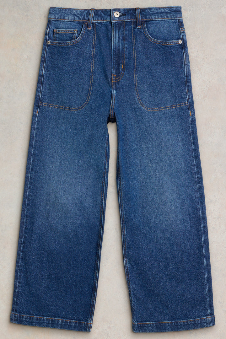Pair of blue jeans on a light gray background
