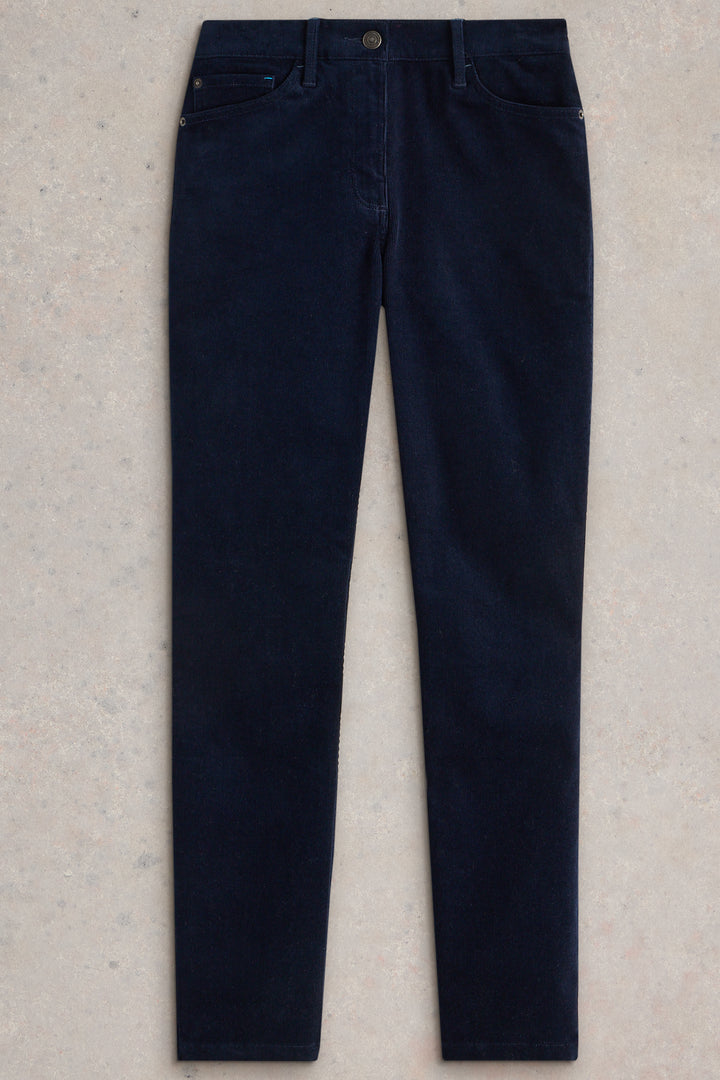 Navy blue jeans on a light beige background
