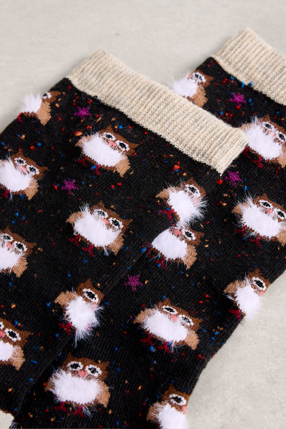 Socks with cat pattern on a neutral background