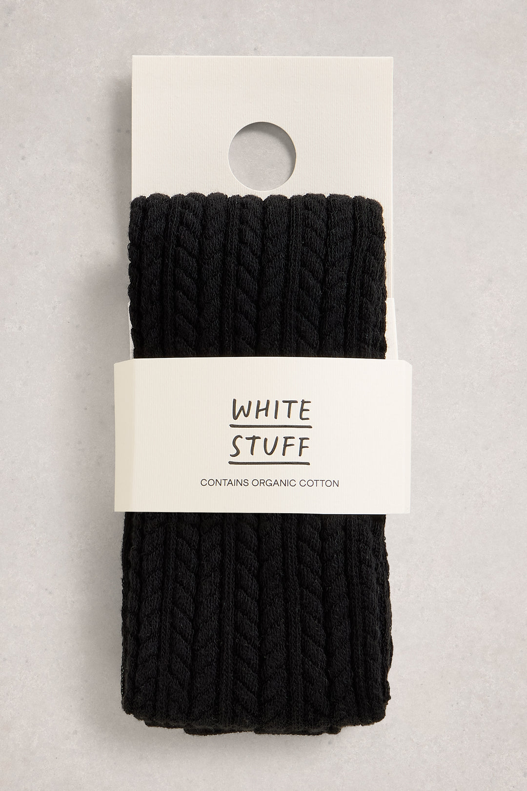 Black knit tights on a white card with 'White Stuff' branding on a light gray background
