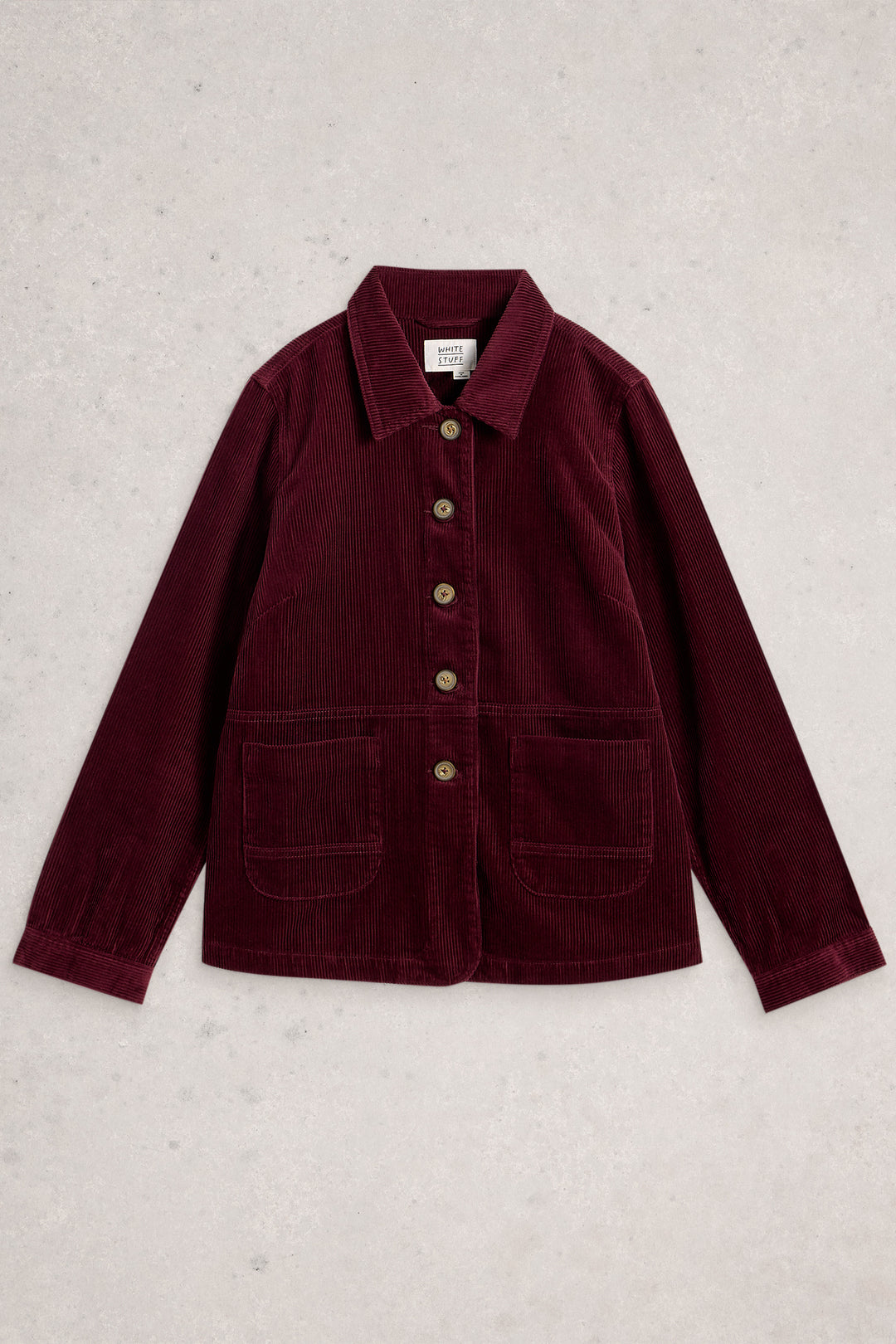 Maroon jacket with button details on a light gray background