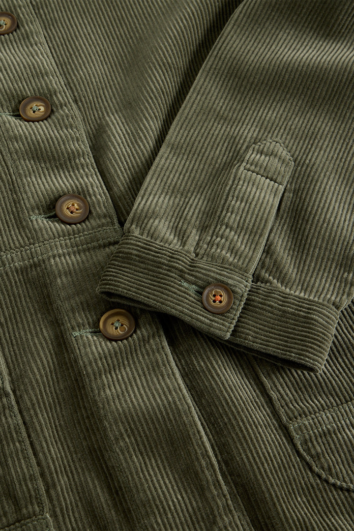 Close-up of a green corduroy jacket with buttons