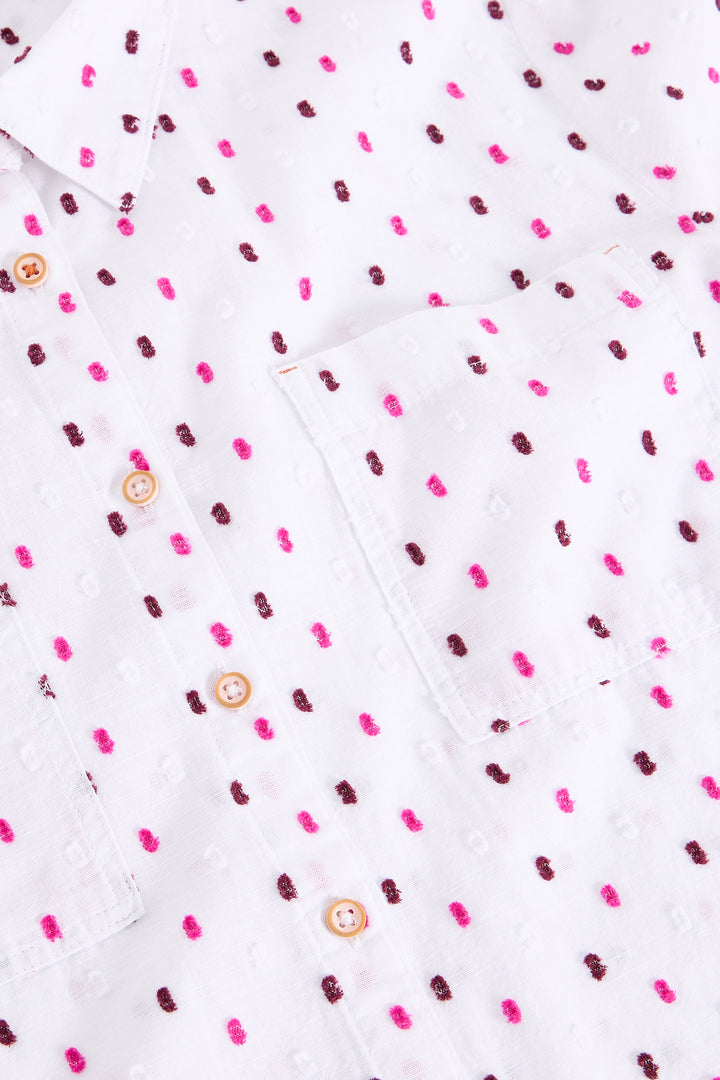 White fabric with pink and brown dot pattern