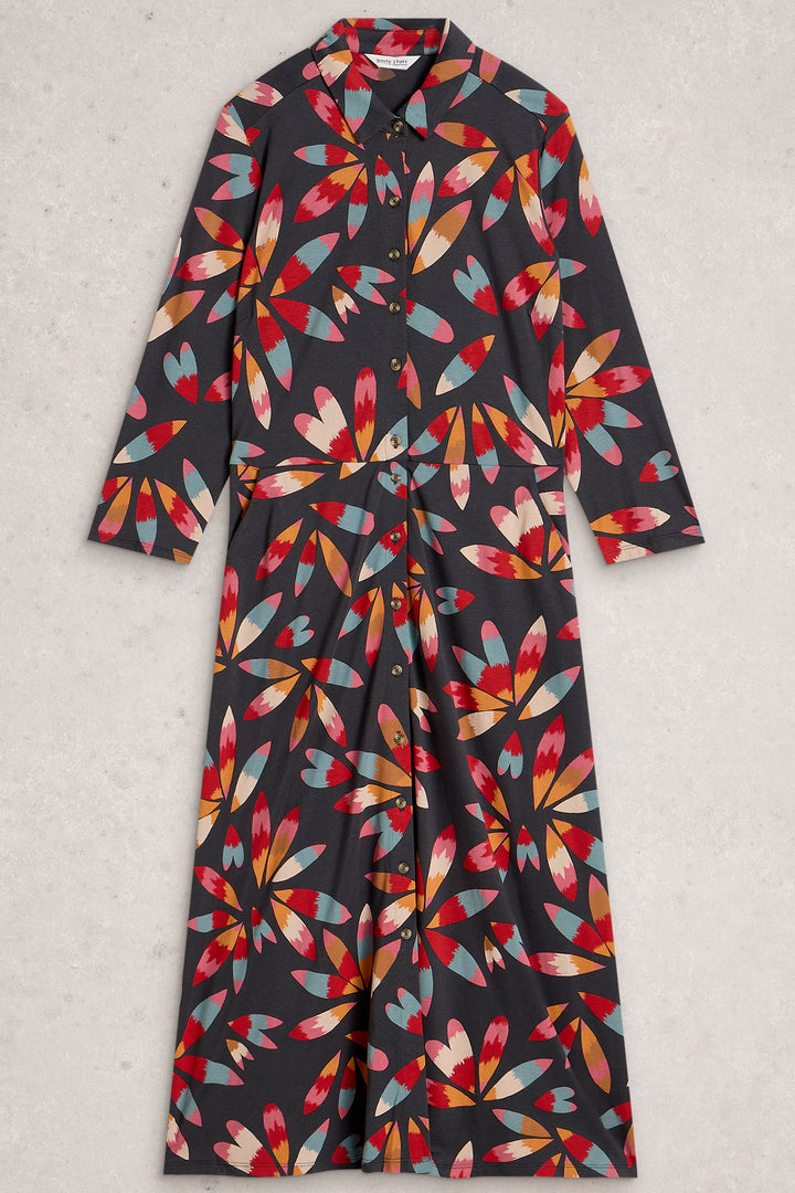 Long dress with colorful abstract pattern on a light gray background