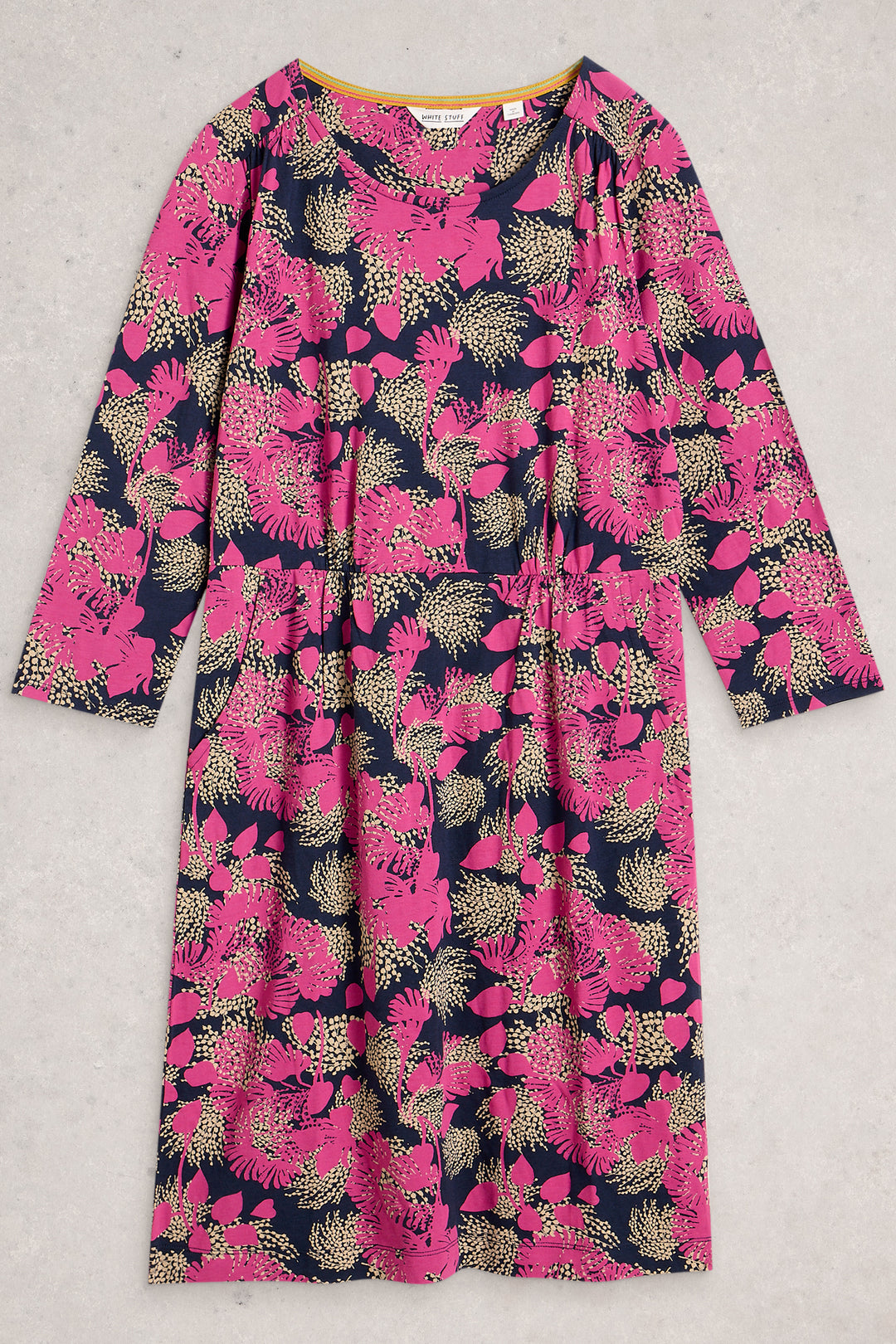 Pink and navy floral dress on a light gray background